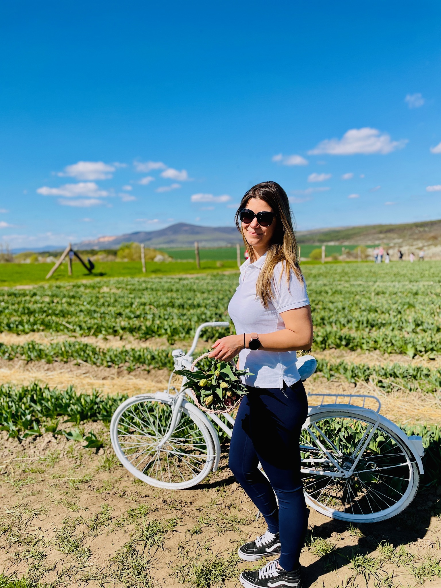 Charlotte outdoors with a bicycle